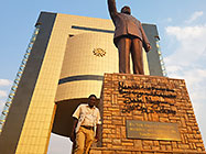 Elias showing Presidential statue in front of museum