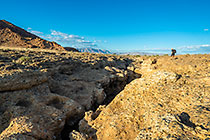 Chanan walking along narrow canyon