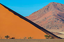 sand dune slope & moutain at sunset