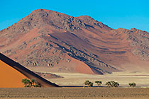 sand dune slope & moutain at sunset