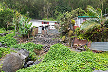 houses near mountain stream