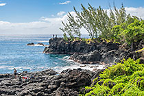 fishermen on rocky shore