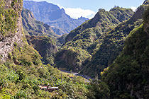 houses in valley between mountain peaks