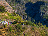 house on plateau & gorge & mountains