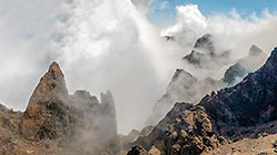 moonscape mountain peaks under clouds