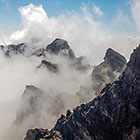 moonscape mountain peaks under clouds