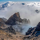 moonscape mountain peaks under clouds