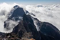 moonscape mountain peaks under clouds