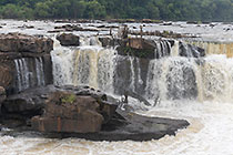 waterfall between rocks at sunrise