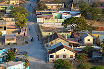 people on street beween city houses