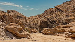sandy track in rocky riverbed