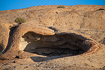 cave rock formation on granite monolith mountain