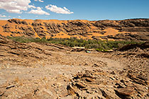 ranger camper driving down rocky steep track into canyon
