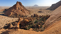 track through rocks at base of monlith moutains