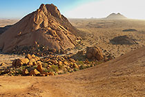 track through rocks at base of monlith moutains