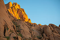 James & friends climbing monolith mountain at sunrise