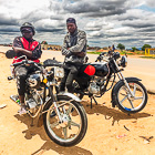 motorcyclists at market
