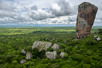 rock formation & green trees