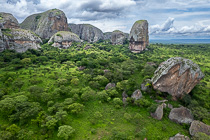 rock formation & green trees