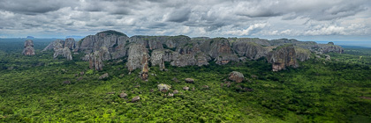 rock formation & green trees