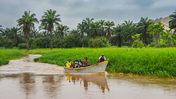 people in fishing boat on river
