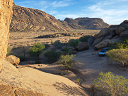 ranger camper at wildcamp between granite boulders