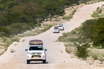 camping cars driving on gravel road