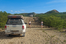 Jojo & Mathou checking gravel road near camping cars