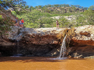 James jumping into waterfall pool