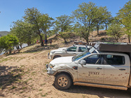 camping cars parked next to river