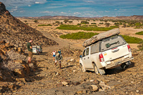 Marie, Manon, Mathou, Paul & Simon takling pictures of camping car driving down rocky slope