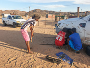 mechanics repairing ranger camper brocken shock