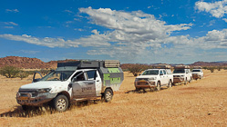 ranger camper & camping cars on track in grassy plain