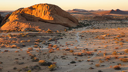plain with granite rocks at sunrise