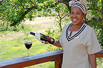 waitress pouring red wine