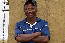 Zulu village : man watching & smiling