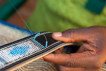 sewing beadles on leather belt